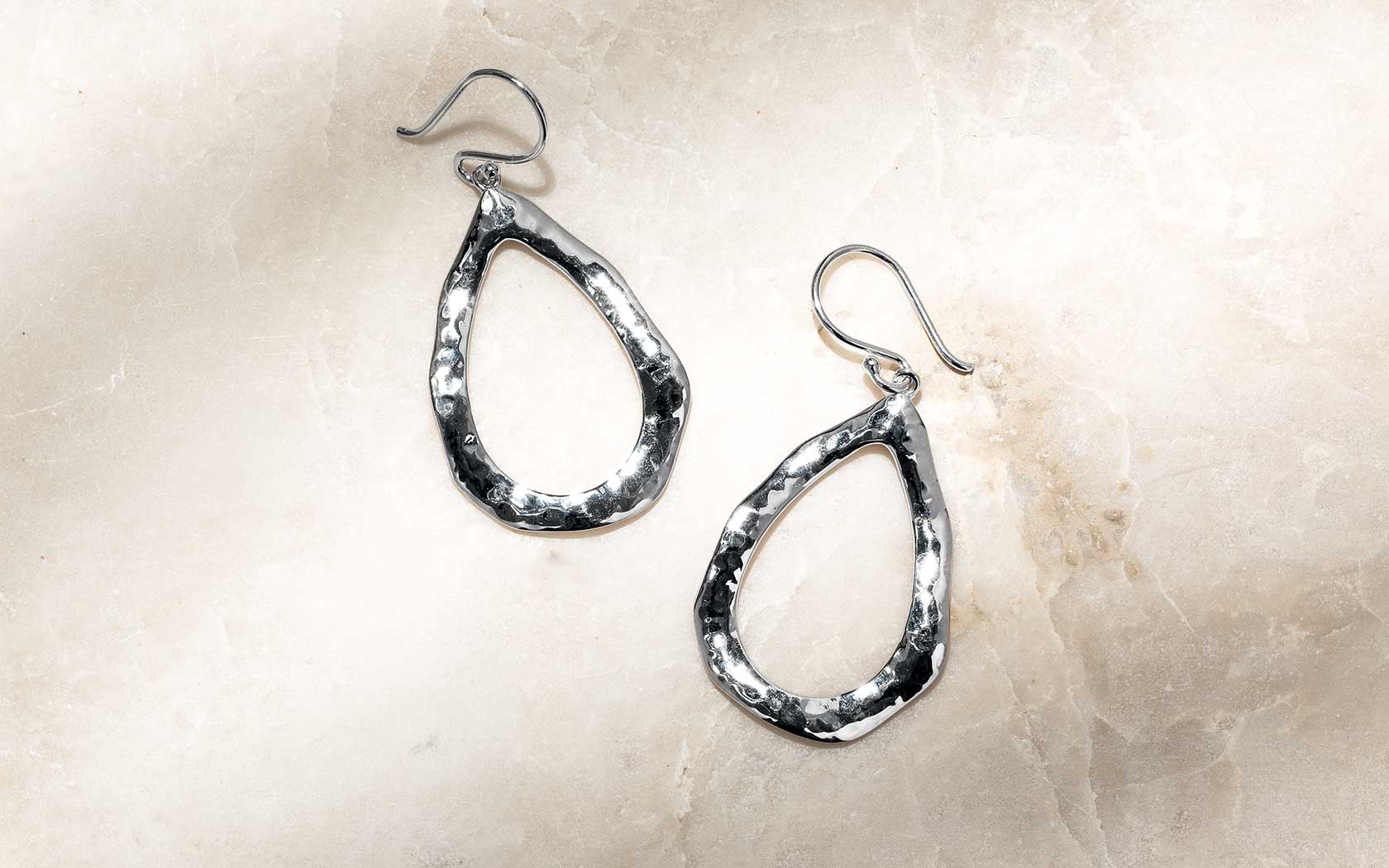A detail of the Waveform metalwork — the signature flowing lines of Laguna Key
