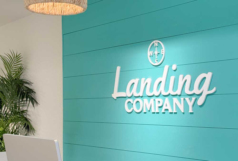 Landing Company John's Pass Village Logo Sign