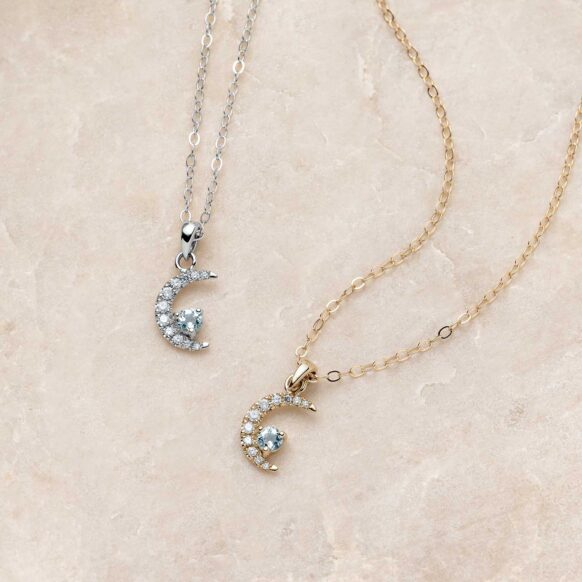 Crescent Moon Aquamarine and Diamond Necklace on Stone